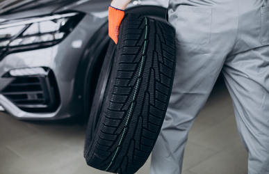 mechanic changing tires car service